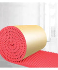 Badass Red Self Adhesive Egg Crate Soundproofing Foam Panels 7cm Thick rolled, showcasing texture for acoustic insulation use.