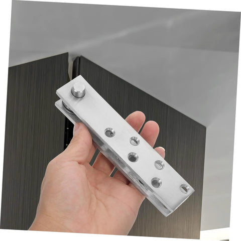 Hand holding 360 Degree Heavy Duty Stainless Steel Invisible Pivot Hinge for Secret Doors and Hidden Bookcases by DOITOOL