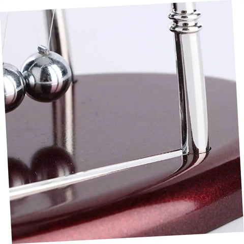 Close-up of Newton's Cradle Pendulum Dynamics Learning Kit base and metal frame for hands-on education and decor.