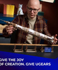 NASA Saturn V 3D Wooden Puzzle Kit For Adults Dope 26 Inch Tall Rocket Model displayed by man holding assembled wooden rocket
