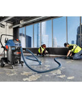 Two Hose Vacuum Y Connector For Dust Extractor System with professionals using secure fit port in a construction environment.