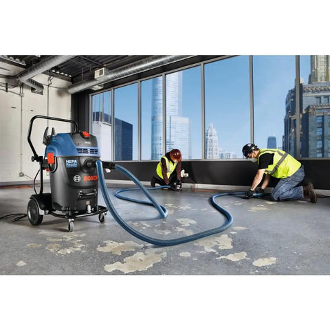 Two Hose Vacuum Y Connector For Dust Extractor System with professionals using secure fit port in a construction environment.