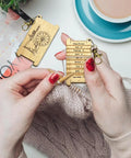 Straight Up Essential Vintage Wooden Wrap Per Inch Guide Gauge For Spinners Lowkey Legendary Yarn Wrap Board With Diz Spot On Accurate Measuring Tool For Lace Dk Yarns Boss Level Crochet Accessory And Crafting Staple held by a person measuring yarn.