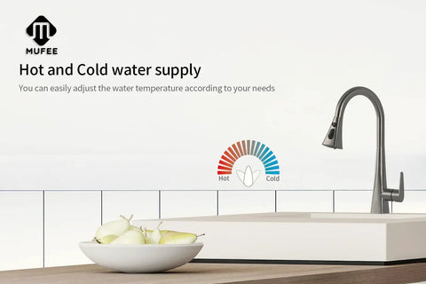 High Arc Single Handle Kitchen Faucet With Pull Down Sprayer In Matte Gray Stainless Steel next to fruits on counter.