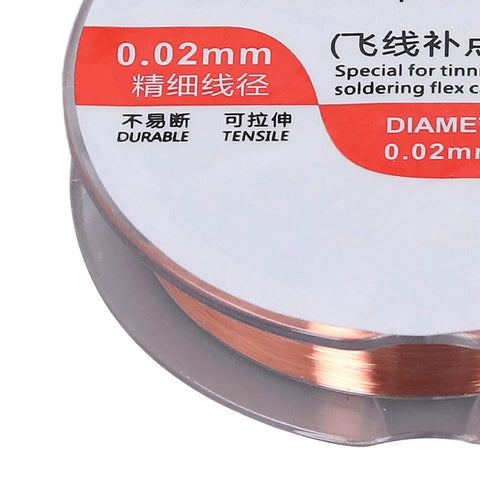 Close-up of spool of 0.02mm copper wire for soldering, red and white label, durable and tensile text visible, top view.