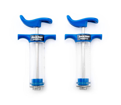 Dual syringes from BKM12 Hydraulic Brake Bleed Kit For Mineral Oil with blue handles shown isolated on white background.