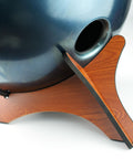 Built Like A Tank Wood Handpan Stand, Compact Display Rack For Steel Tongue Drums, showing support for a steel tongue drum.