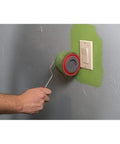 Using the Absolute Game Changer Nine Piece Paint Roller Kit for no sweat wall painting in green.