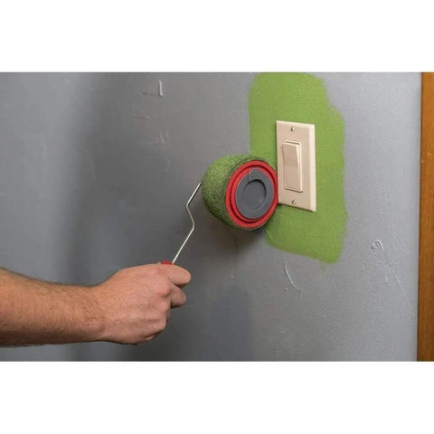 Using the Absolute Game Changer Nine Piece Paint Roller Kit for no sweat wall painting in green.