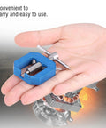In-hand view of blue mini RC gear puller with stainless screw for pinions and bearings