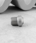 Close-up of a heavy-duty stainless steel spray nozzle, part of a two-pack pressure washer nozzles with 1/8 inch NPT thread, 25 degree pattern, 4000 PSI, surface cleaner nozzles built for decks, driveways, and vehicles.