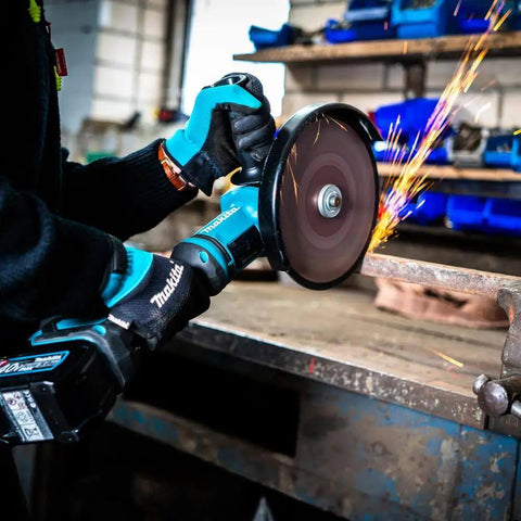 User operating a Heavy Duty 40V XGT Angle Grinder With 1700W Equivalent Muscle And Snappy 6600RPM Action for cutting steel.