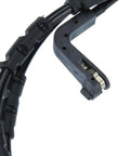 Front brake pad wear sensor, black plastic housing with wiring harness and metal contact clip