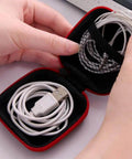 6 Pack Tough As Nails PU Hard Shell Earbud Cases Small Square Zipper Carry Pouches with cables inside for secure storage.