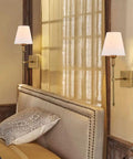 Two Pack Brushed Brass Wall Sconces With Fabric Shade, hardwired vanity lighting in a bedroom with gold finish and mounting hardware