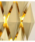 Close-up of a Modern Nordic Wall Sconce with glare-free LED accent lighting, sleek golden triangular design, 28 cm.