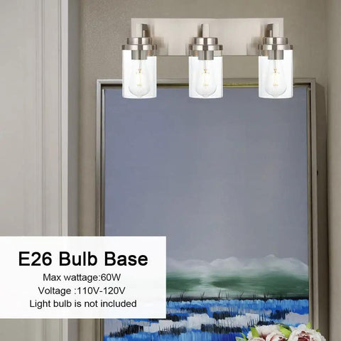 Three Light Vanity Light Fixture In Brushed Nickel With Clear Glass Shades For Modern Bathrooms, shown over artwork.