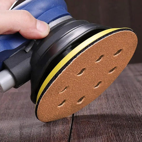 Huge 150 Pack Of 5 Inch Hook And Loop Sanding Discs With 40 To 800 Grit Range Made From Durable Aluminum Oxide on an orbital sander.