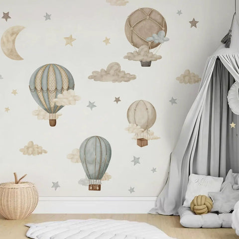 Watercolor Hot Air Balloon Fabric Wall Sticker Peel and Stick Decals With Stars and Clouds for Baby Nursery Kids Bedroom Playroom Decor 120 x 40 cm Eco Friendly Non Toxic Pre Cut Totally Kid Friendly displayed on a nursery wall with a cozy tent.