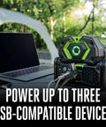 Hella Reliable Portable Pure Sine Wave Power Inverter Pumping 400w Continuous And 800w Peak Watts charging three USB devices outdoors.