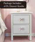 Snag These Premium Vintage Pink Bow Cabinet Knobs 6 Pack Farmhouse Traditional Solid Metal Drawer Pulls on white nightstand.