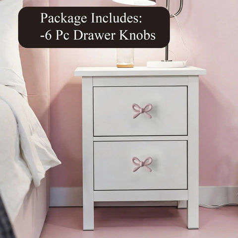 Snag These Premium Vintage Pink Bow Cabinet Knobs 6 Pack Farmhouse Traditional Solid Metal Drawer Pulls on white nightstand.