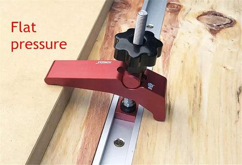 Heavy Duty T Slot Hold Down Clamp Set For Precision Woodworking Benches with black knob and aluminum base securing wood.