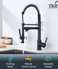 Boss Level Heavy Duty Commercial Style Kitchen Sink Faucet With Single Handle Pre Rinse Sprayer And High Arc Pull Down Matte Black Finish, shown in use.