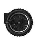 Rear wheel of MX125 Dirt Rocket Electric Dirt Bike For Kids 7 Plus With Motocross Geometry, 12 inch pneumatic tire close-up, black