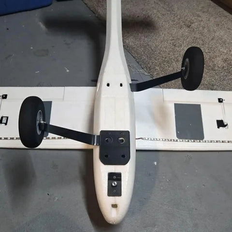 Aeroscout RC Plane Tail Wheel Conversion Kit With Rear Wheel Landing Gear Upgrade installed on fuselage, showing secure fit.