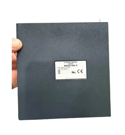 RKD514HC High Precision Motion Control Motor Driver for industrial automation, shown in hand for scale and design.