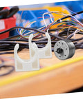 ARTIBETTER white plastic motor clamp brackets for DC geared brush motors; 20-pack shown with small DC motor.