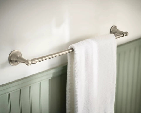 24 Inch Wall Mount Towel Bar In Brushed Nickel Finish holding towel, simple single bar design in bathroom, coordinates with bath accessories