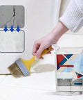 Heavy Duty Concrete Crack Filler And Cement Repair Sealant With Precision Fill Tip being applied to a concrete crack with a brush.