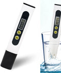 Digital Water Tester For Drinking Water Three In One Meter 0 To 9990 PPM Water Quality Tester With Titanium Probe Sensor next to glass