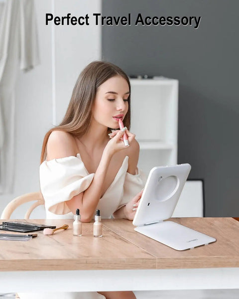 Woman using Rechargeable Travel Makeup Mirror With Light 7x5 Inch Portable Lighted Vanity Mirror 10X Magnifying LED for grooming.