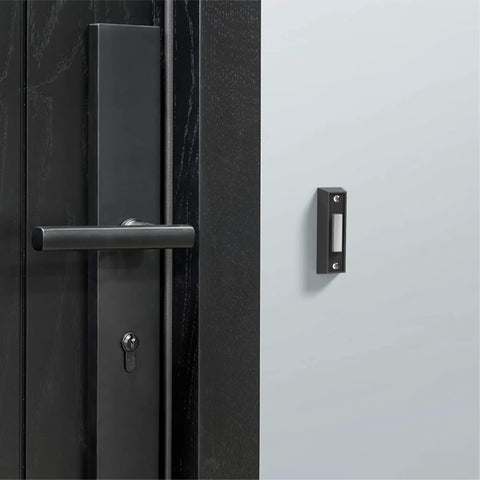 LED Lighted Doorbell Button In Black Plastic on a modern door with handle, Classic Rectangular Design, BT4BL Replacement