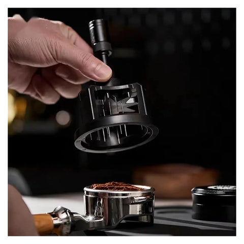 Slick Adjustable Coffee Distribution Tool And Rotatable Espresso Tamper Set For Badass Baristas 51 54 58 Millimeter Compatible held above coffee grounds.
