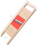 Angled view of Wave Waffle Crinkle Cutter Set with stainless steel blade and red insert in a wooden frame