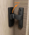 Black heavy-duty flip latch lock installed on wooden door showing swivel function, zinc alloy, for gates barns garages fences cabinets