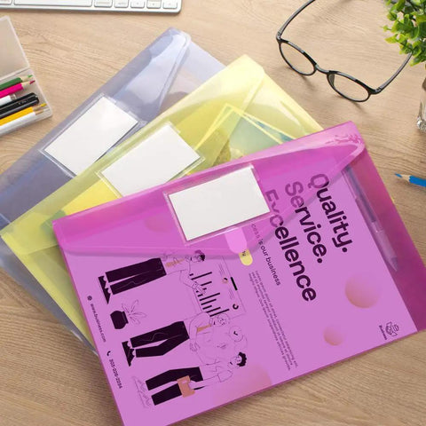 10 Pack Clear File Folders With Transparent Envelopes, Assorted Color Poly Document Folders With Label Pockets on a desk