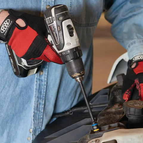 Person using dual sided hex driver with 5/16 and 3/8 inch hex bits in a drill, six inch magnetic reversible tool for home projects.