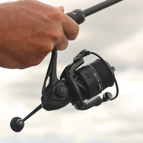 Angler using M1 Spinning Reel For Freshwater Fishing With 9 Plus 1 Ball Bearings 26 Lb Max Drag Five Point Two Gear Ratio