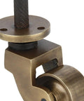 Heavy Duty Brass Stem Casters Set Of 4 With Antique Brass Finish close-up of one caster showing threaded stem and wheel