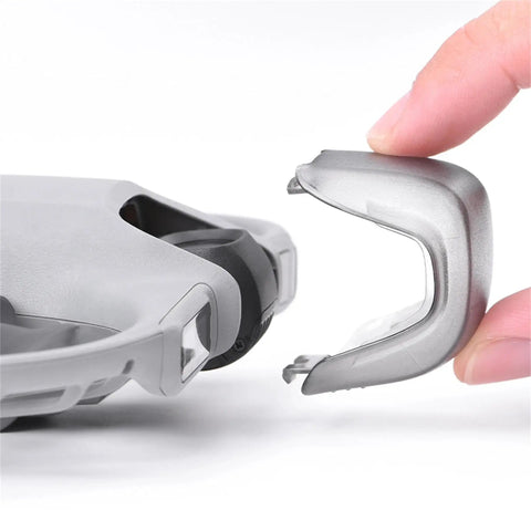 Drone Lens Cover Set For DJI NEO 2, 2 Pack Gimbal Protector Caps being attached to the drone, showing protective design.