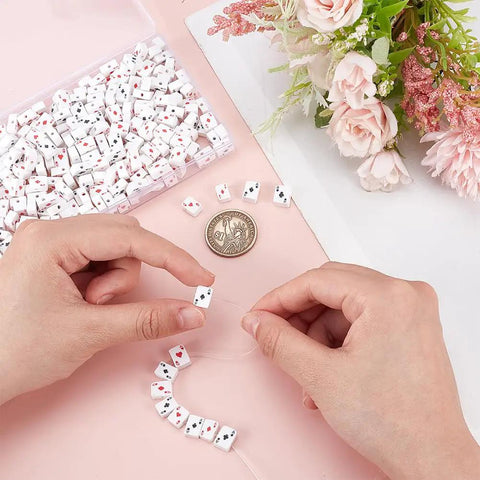 Hands stringing polymer clay beads poker card print flat rectangle spacer beads 300pcs for jewelry making necklace bracelet DIY accessories.