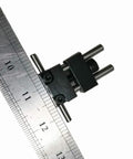 Badass Strength Precision Vise Stop Locators For CNC Milling Machines on a ruler, showcasing precise steel dimensions.