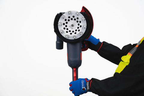 Person holding grinder fitted with Star Turbo 7 Inch Diamond Cup Wheel With 10 Segment Turbo Design For Concrete Grinding