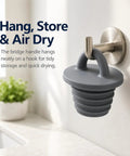Four Pack Silicone Bathtub Drain Stopper Designed For Easy Pull Loop Handle With Slick Watertight Sealing That Blocks Hair Clogs To Keep Your Daily Routine Easy Peasy hanging on a wall hook for storage.