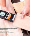 Heavy Duty 4 In 1 Stud Finder And Wall Scanner acting as a straight shooter measuring wood moisture on planks with LCD display.